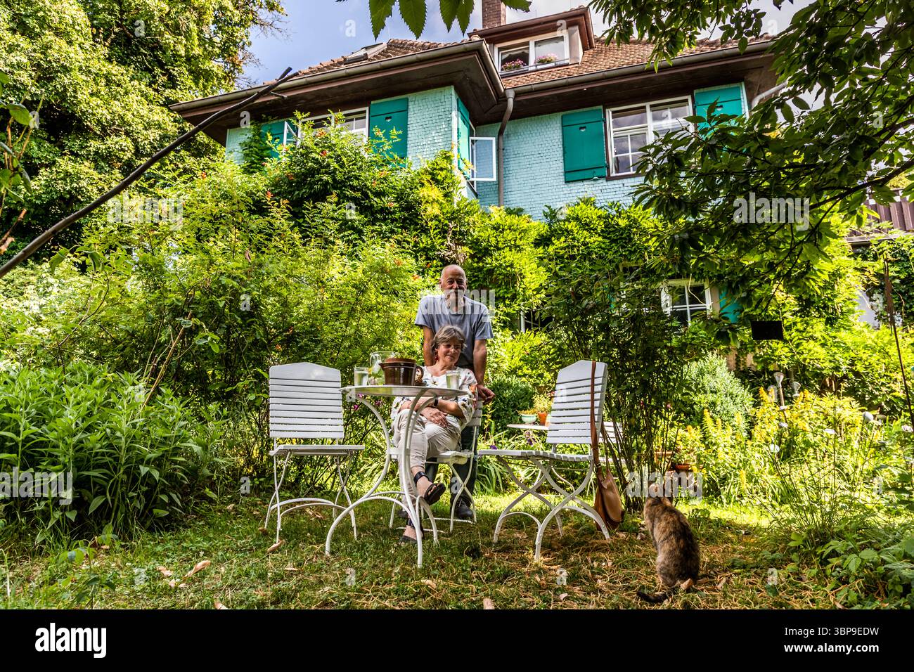 Eva Eberwein and her husband Bernd Eberwein in the garden of their house, which they purchased in 2003. After a complete renovation, the house and garden were listed as cultural monuments of special significance in the Baden-Württemberg monument register in 2004. In 2019, Eva Eberwein decided to rename the house Mia and Hermann Hesse House. Previously, it was known only as Hesse House and did not acknowledge the memory of Mia Hesse. Gaienhofen, Baden-Württemberg, Germany Stock Photo