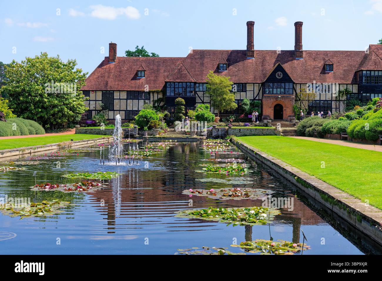The Old Laboratory building and canal at the RHS Gardens Wisley on a sunny summers day, Surrey England UK Stock Photo