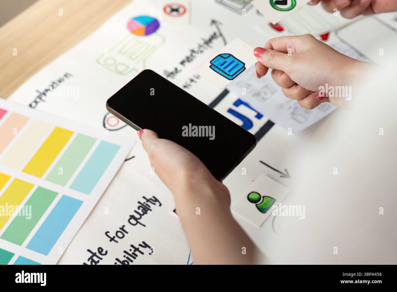 UX and UI Design. Hands holding smartphone and design elements for ...