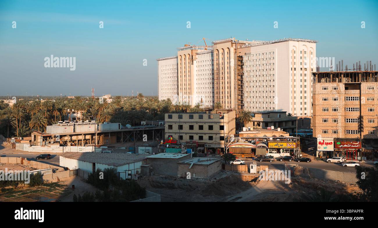Iraq Commiunity High rise buildings and traditional structures coexist in Karbala, Iraq ...