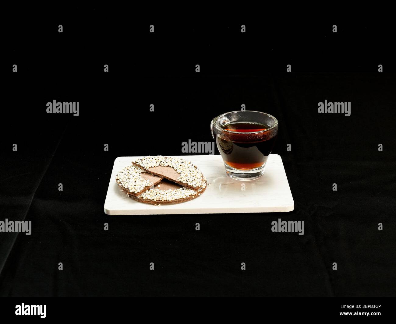 Hot Coffee and Traditional Mexican Chocolate Cookie on Black Background Stock Photo