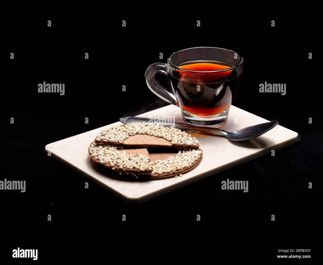 Hot Coffee and Traditional Mexican Chocolate Cookie on Black Background Stock Photo