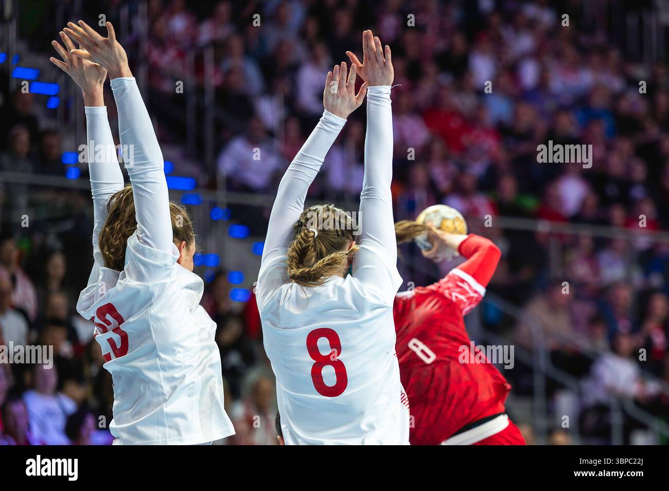 Women players makes block during handball match Stock Photo - Alamy