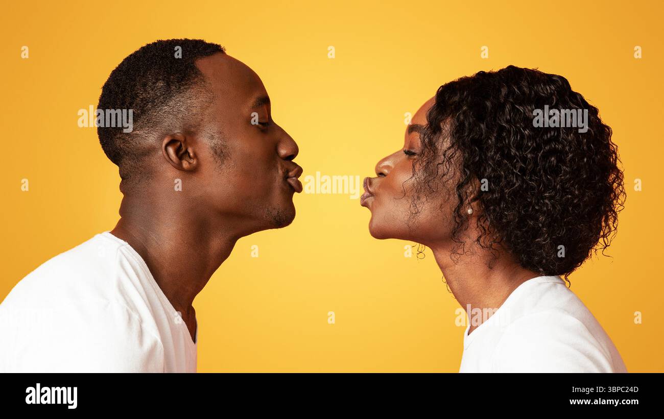 Black man and woman drawn to each other Stock Photo
