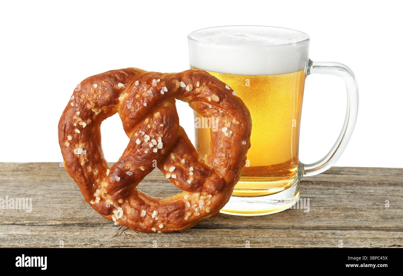 Tasty pretzel and glass of beer on wooden table against white background Stock Photo