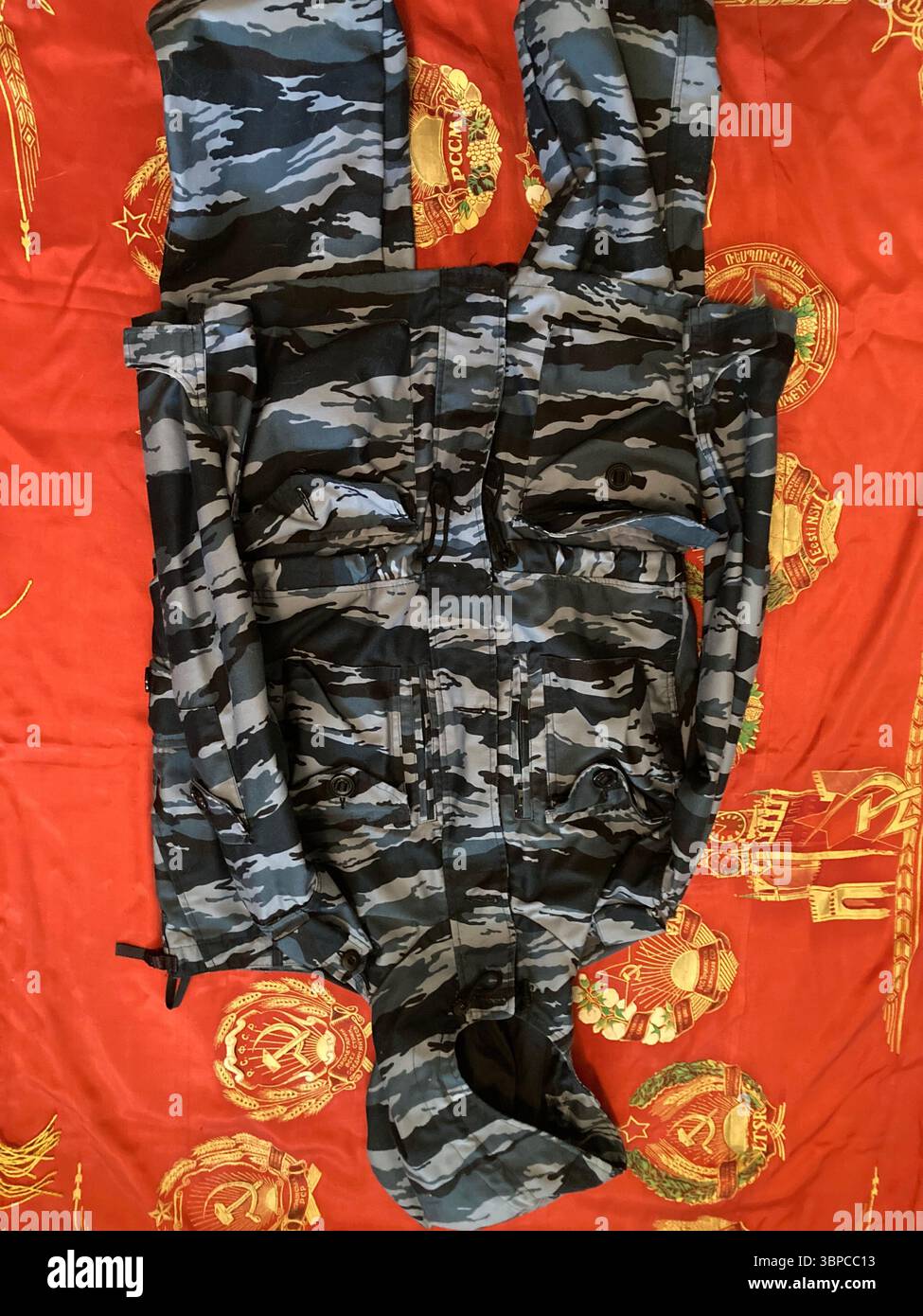 Blue Urban Kamysh Tiger Stripe Camo Uniform Set on Soviet Banner - Smartphone Captured Stock Image