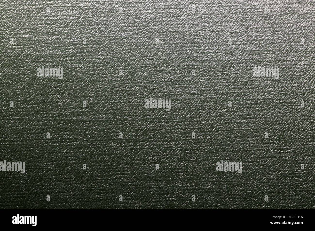 Green textured surface providing a detailed and consistent pattern, perfect for use in various graphic design projects, web design, and presentations Stock Photo