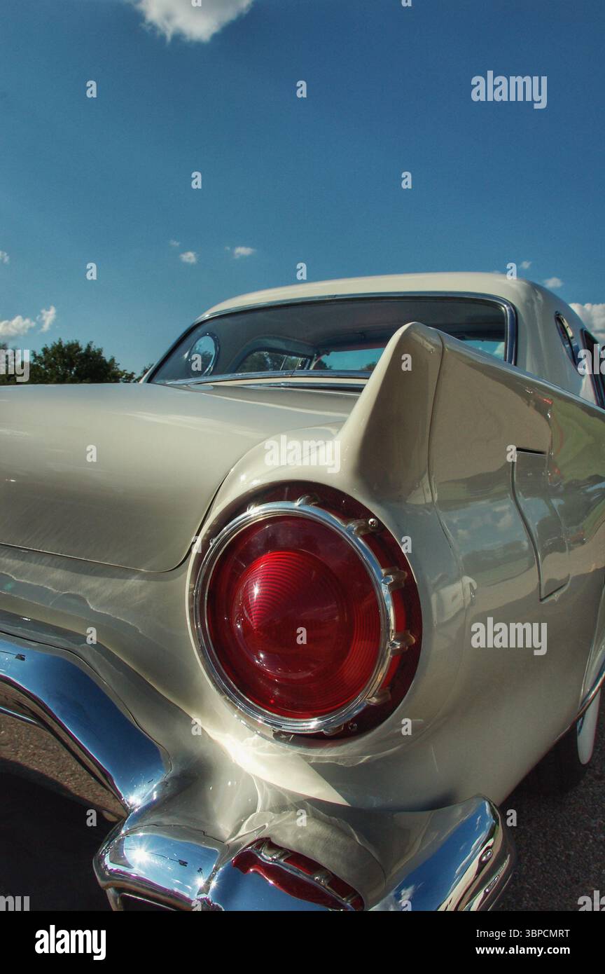 Taillight and rear fender of a 1950's era Ford Thunderbird classic car ...