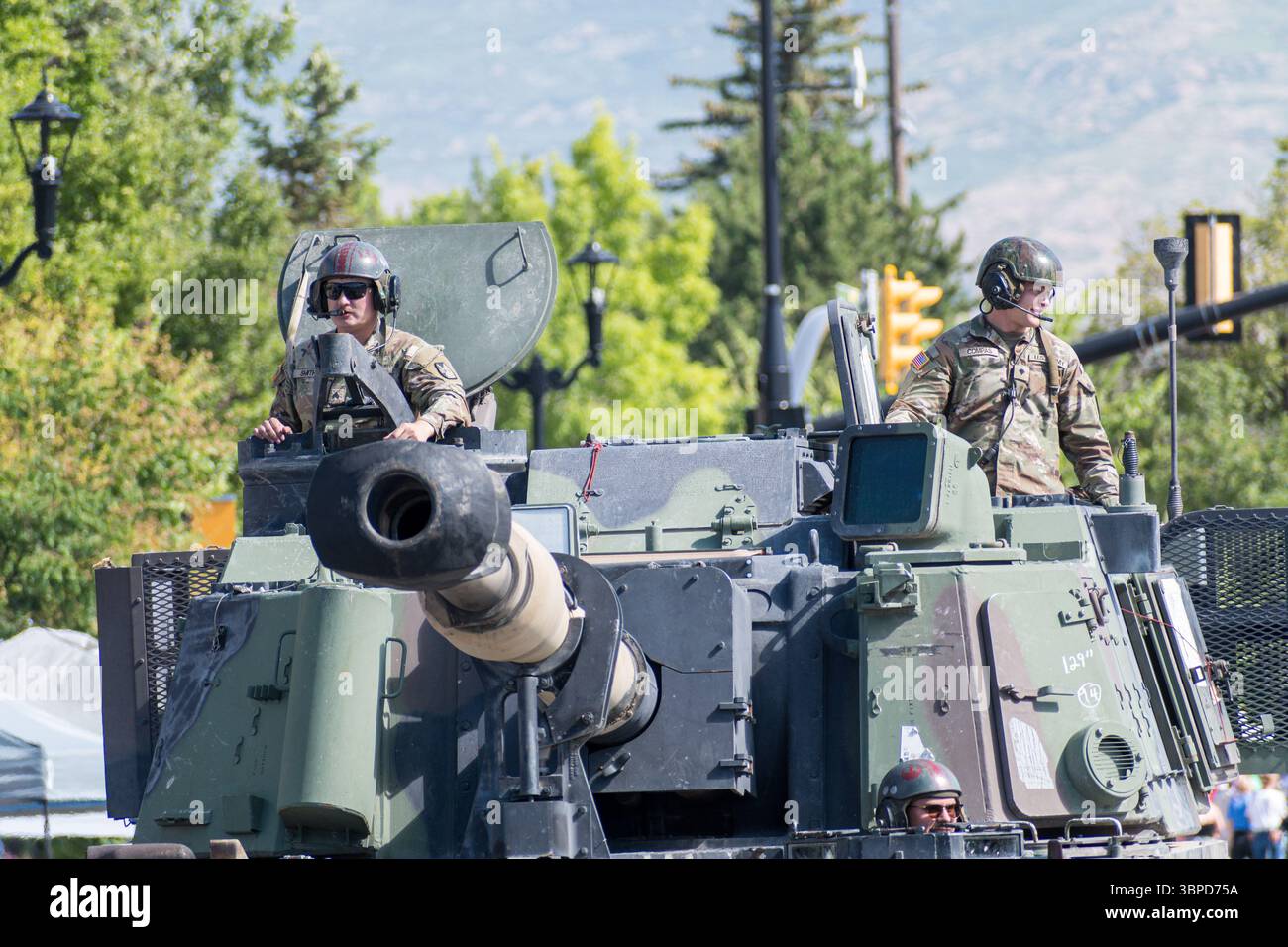 Provo, UT – July 4, 2025: US Army personnel ride atop a military ...
