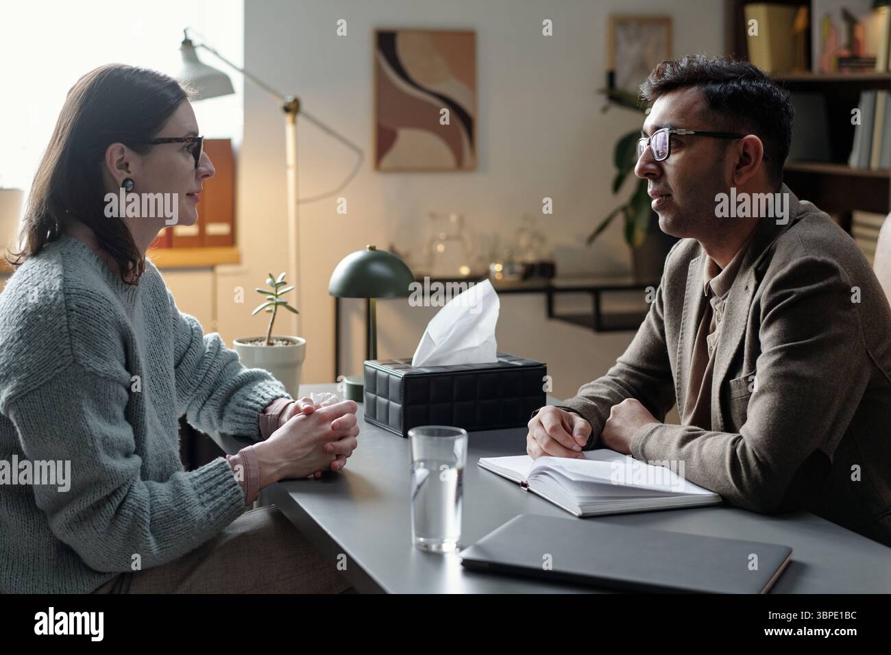 Woman Talking with Man during Therapy Stock Photo