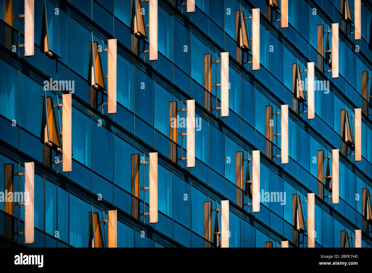 Window Frame Diagonal Design Glass facade with diagonal pattern of reflective blue windows and ...
