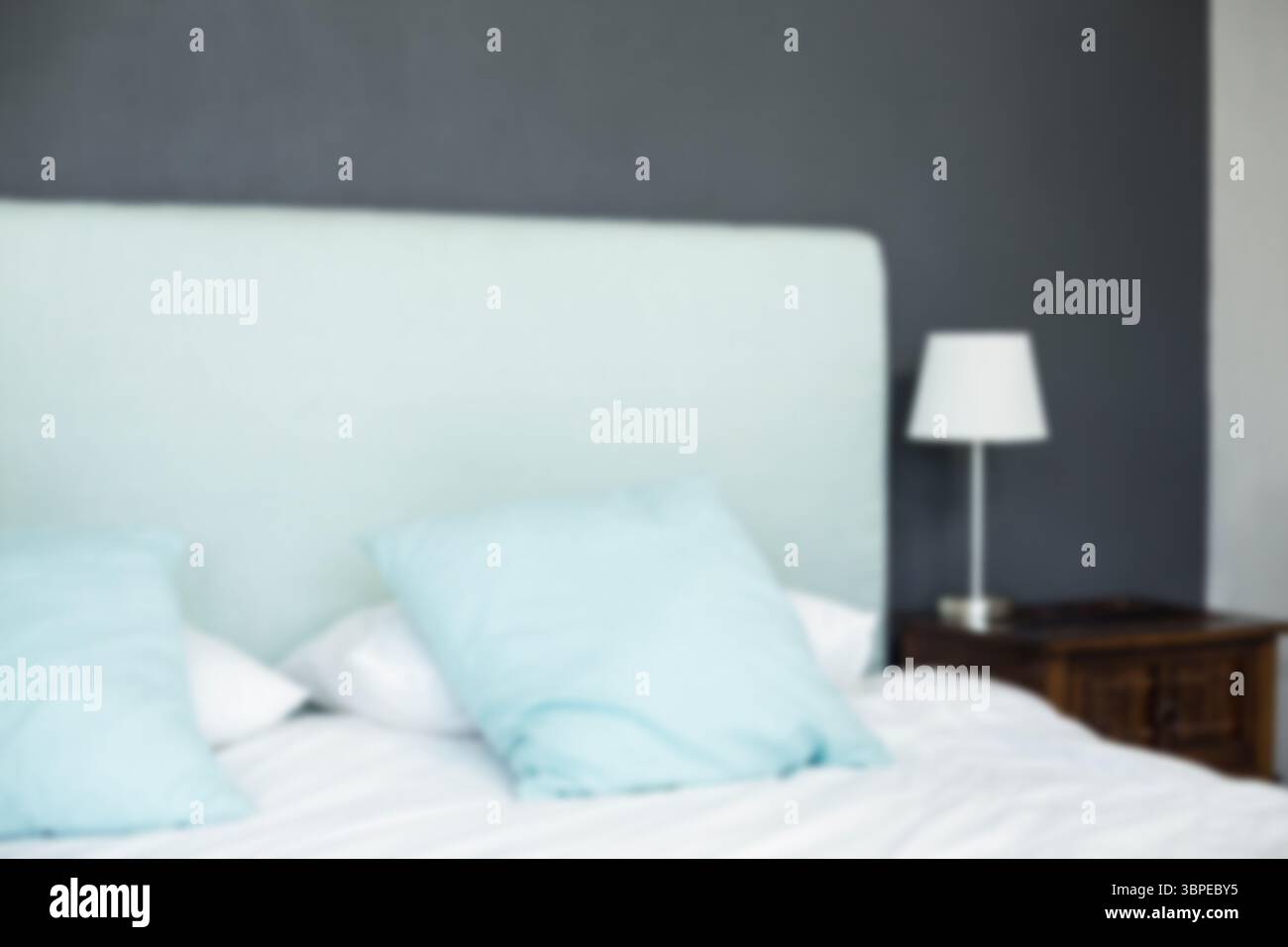Defocused image of bed at home Stock Photo