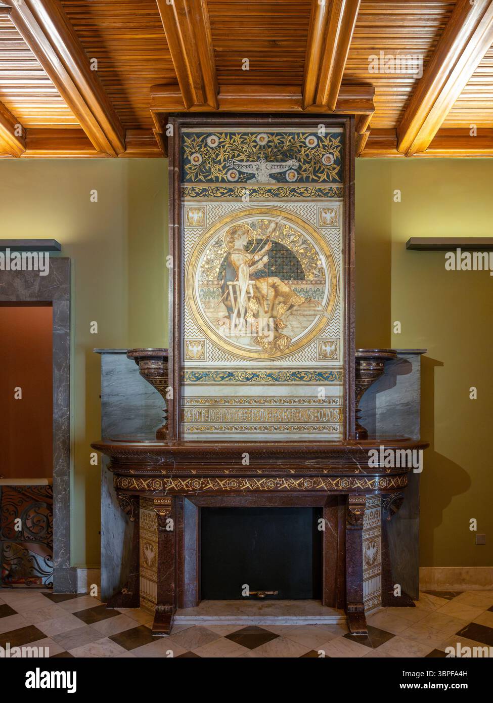 An ornate fireplace with marble and a large painting in a formal room ...