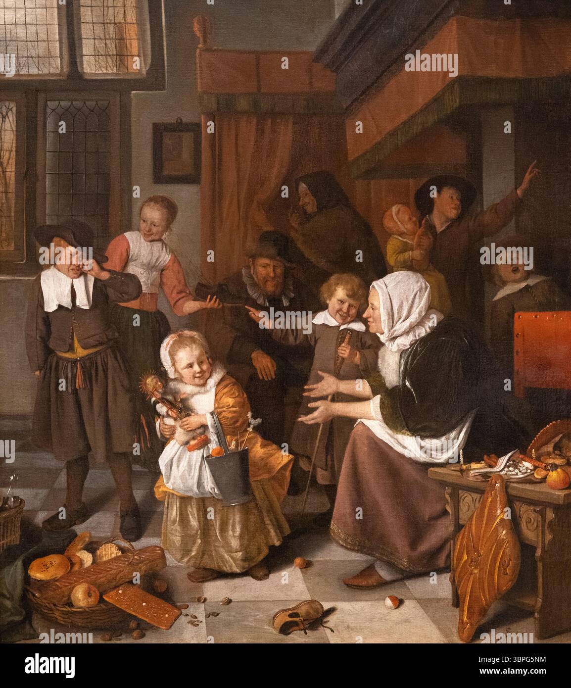 Jan Steen painting, 'The Feast of St. Nicholas'  1665-8; 17th century Dutch painter of  people in the Dutch Golden Age, 1626-1679. Oil on canvas. Stock Photo