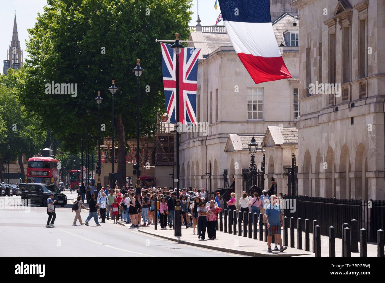 As French President Emmanuel Macron starts his state visit to the UK, the British Union Jack and the French Tricolore flags hang over Whitehall, on 8th July 2025, in London, England. Stock Photo