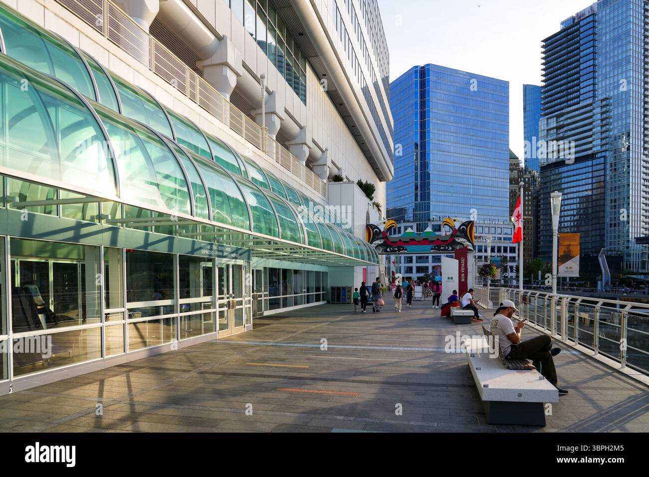 Waterfront promenade of Canada Place, a Convention Centre and Cruise Ship Terminal on the Burrard Inlet in Downtown Vancouver, British Columbia, Canad Stock Photo