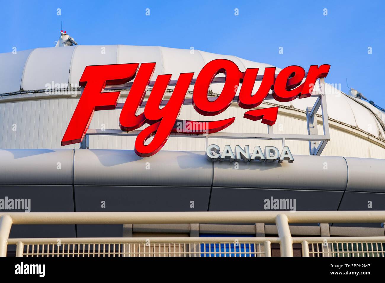 Sign of FlyOver Canada, a flying-theatre attraction in Canada Place in Downtown Vancouver, British Columbia, Canada Stock Photo
