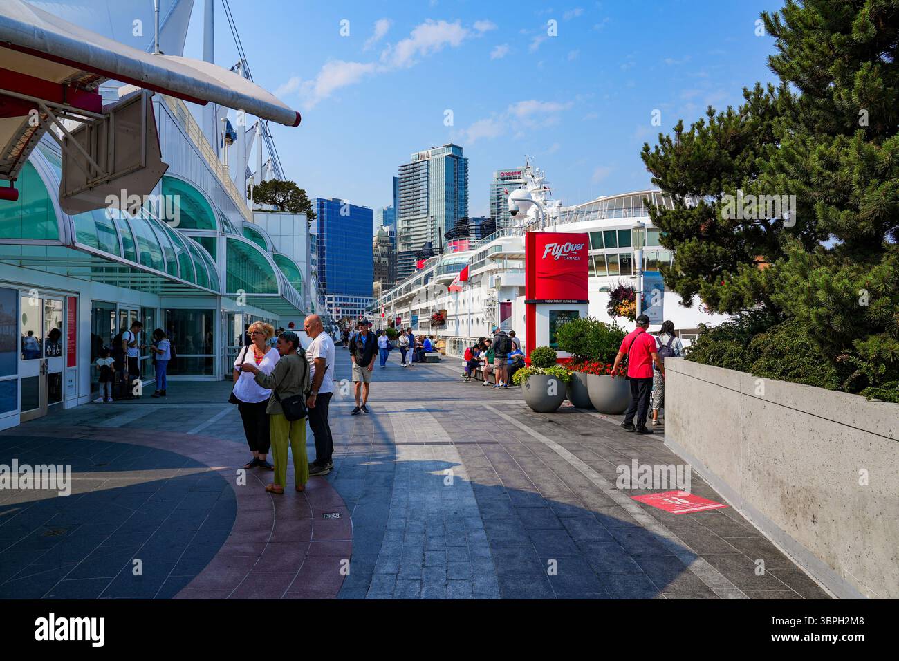 Waterfront promenade of Canada Place, a Convention Centre and Cruise Ship Terminal on the Burrard Inlet in Downtown Vancouver, British Columbia, Canad Stock Photo