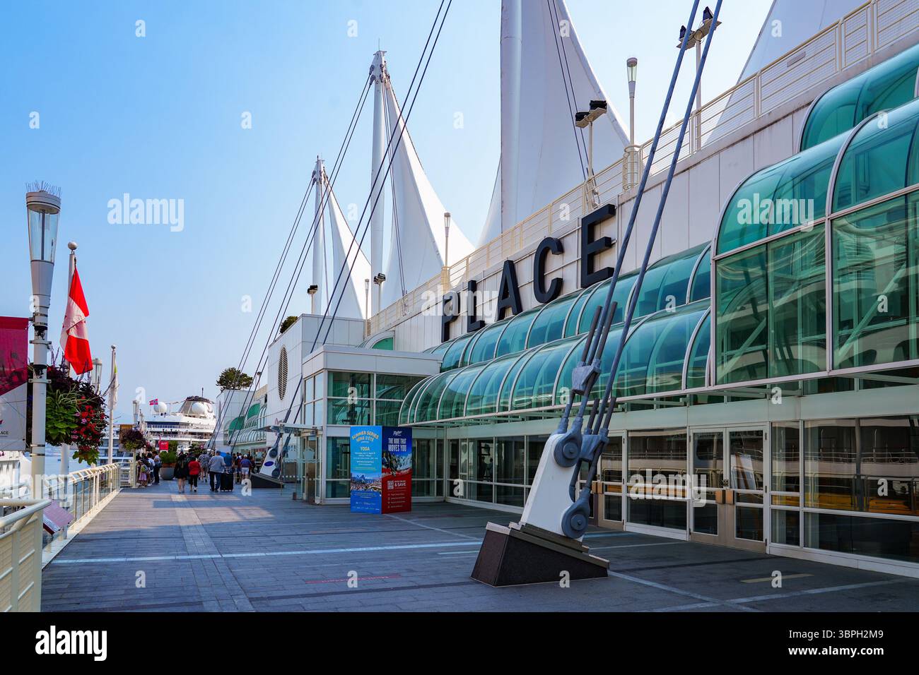 Waterfront promenade of Canada Place, a Convention Centre and Cruise Ship Terminal on the Burrard Inlet in Downtown Vancouver, British Columbia, Canad Stock Photo