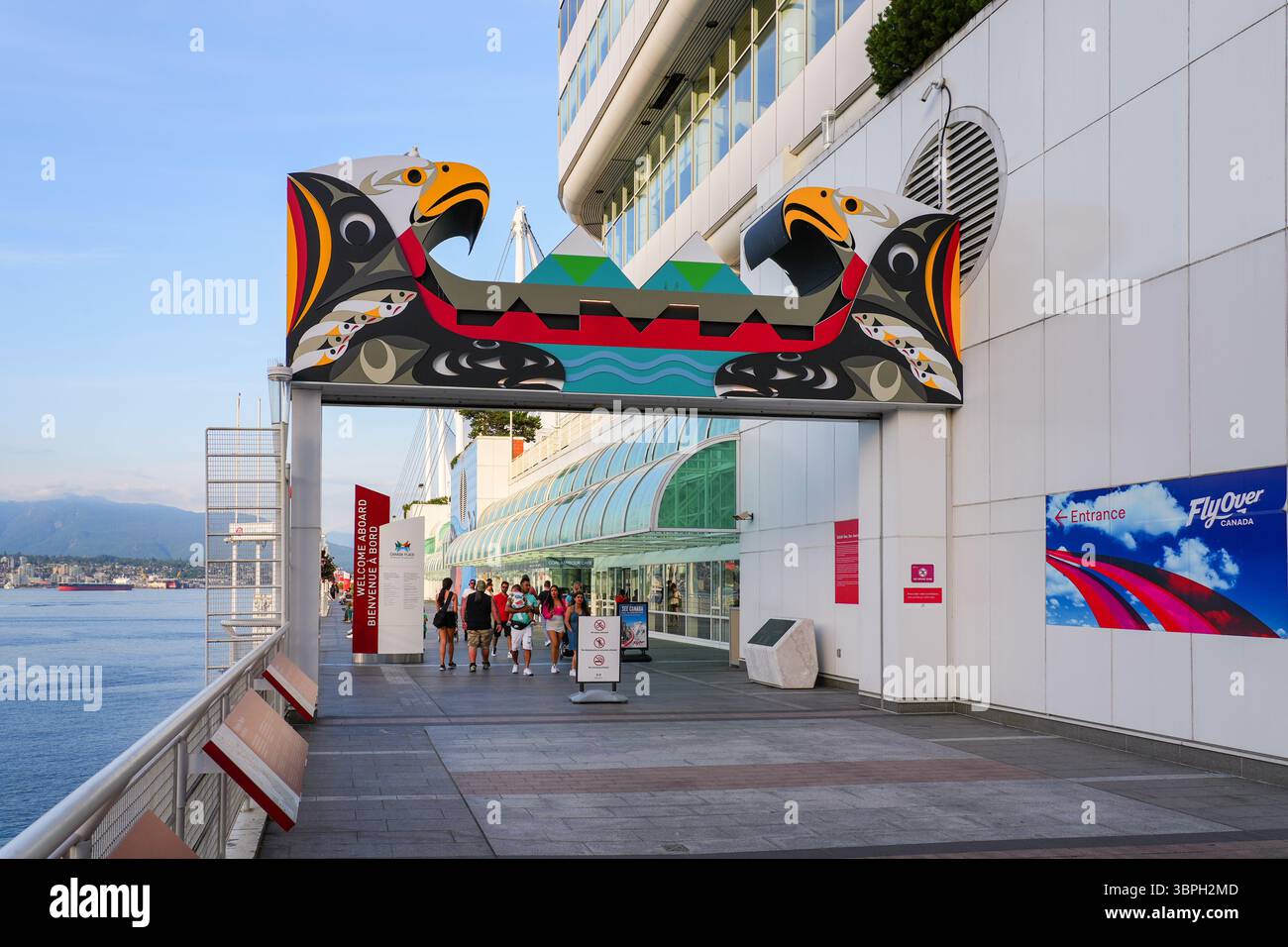 Waterfront promenade of Canada Place, a Convention Centre and Cruise Ship Terminal on the Burrard Inlet in Downtown Vancouver, British Columbia, Canad Stock Photo