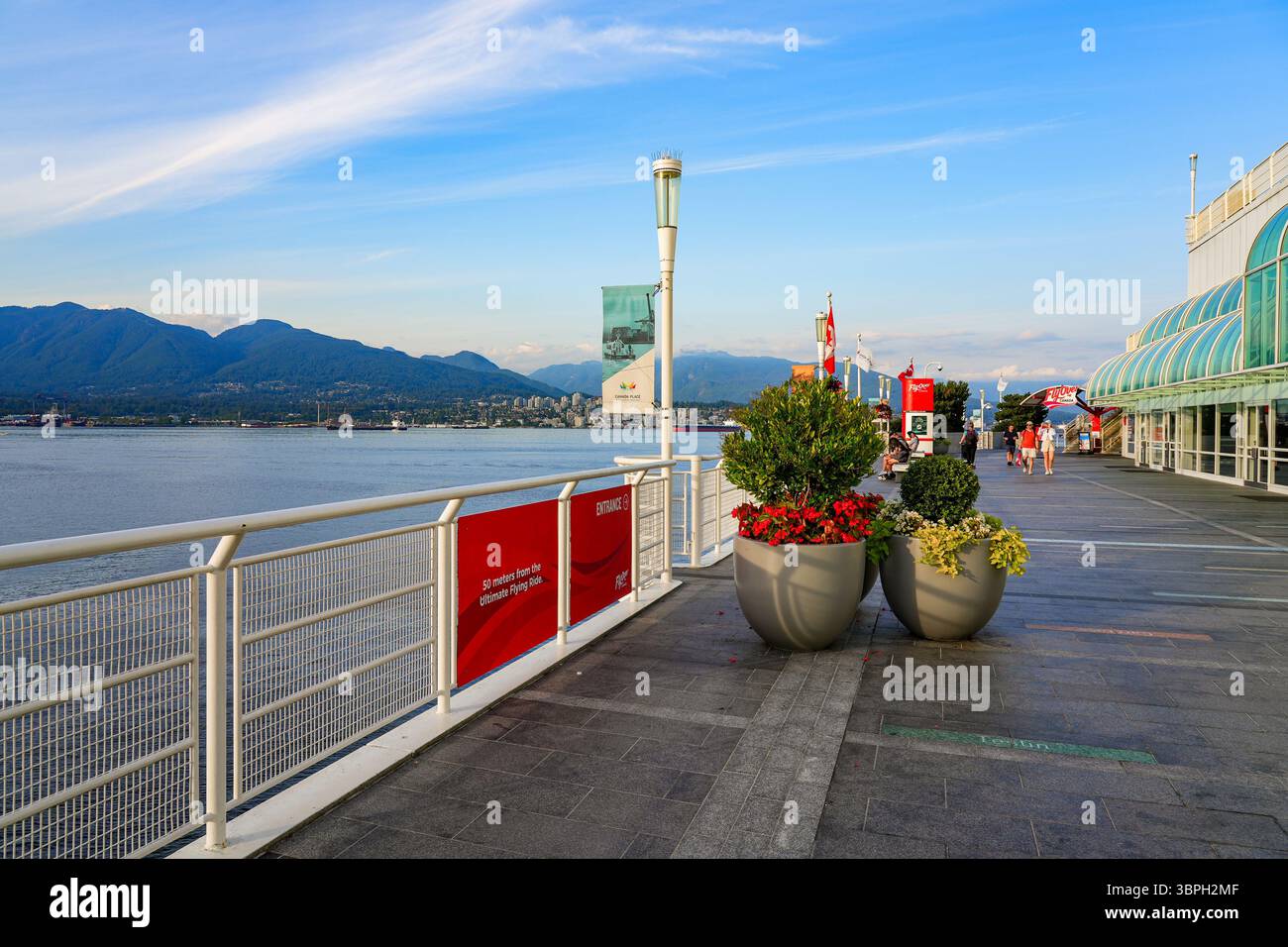 Waterfront promenade of Canada Place, a Convention Centre and Cruise Ship Terminal on the Burrard Inlet in Downtown Vancouver, British Columbia, Canad Stock Photo