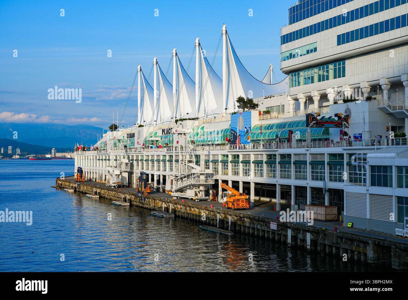 Sails on top of the Canada Place building, a Convention Centre and Cruise Ship Terminal on the Burrard Inlet in Downtown Vancouver, British Columbia, Stock Photo