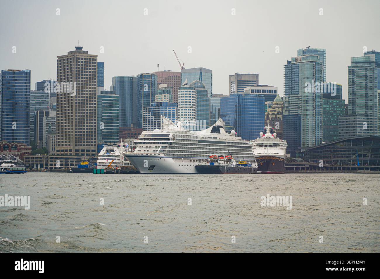 Vancouver skyline with Canada Place, a Convention Centre and Cruise Ship Terminal on the Burrard Inlet in British Columbia, Canada Stock Photo