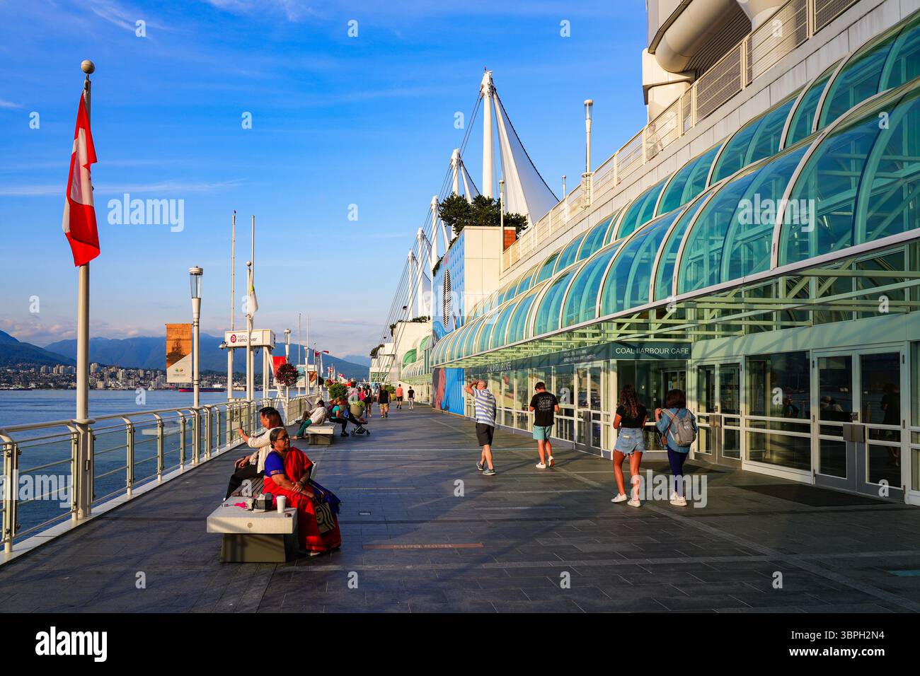 Waterfront promenade of Canada Place, a Convention Centre and Cruise Ship Terminal on the Burrard Inlet in Downtown Vancouver, British Columbia, Canad Stock Photo