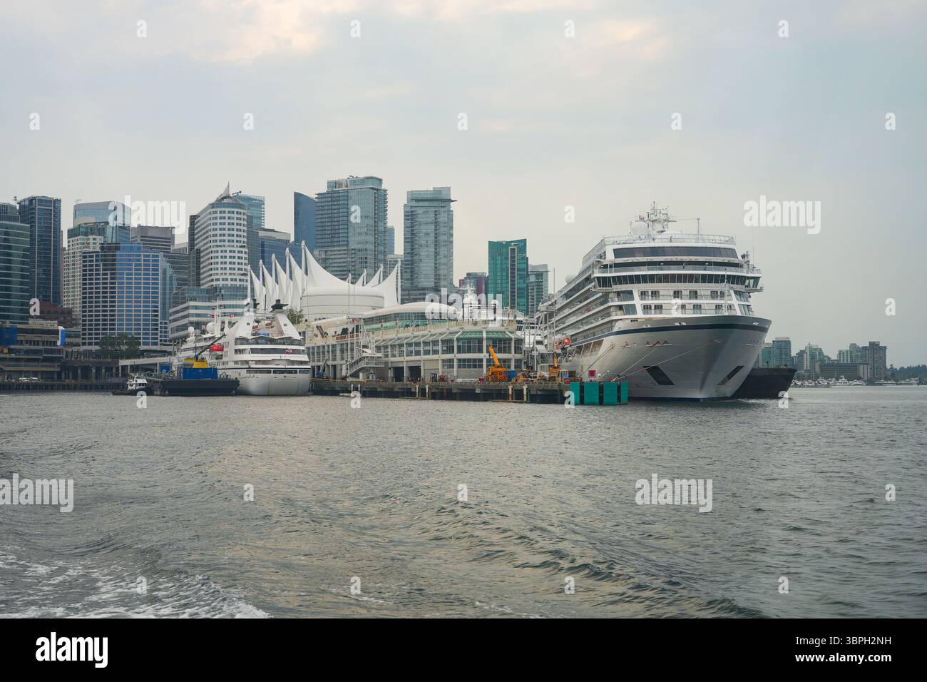 Vancouver skyline with Canada Place, a Convention Centre and Cruise Ship Terminal on the Burrard Inlet in British Columbia, Canada Stock Photo