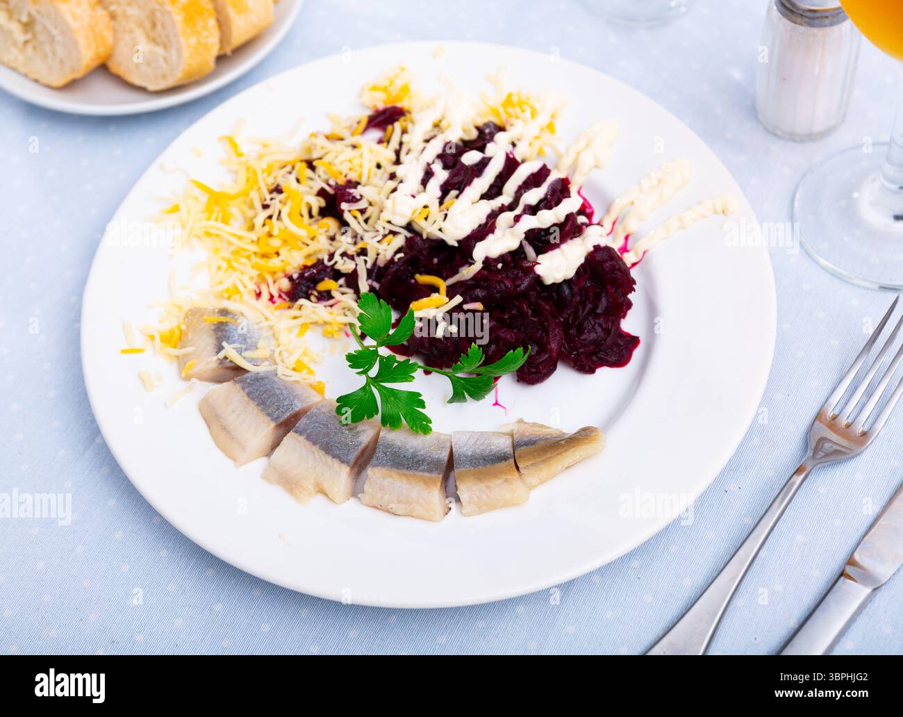 Beetroot served with cheese and pickled mackerel Stock Photo