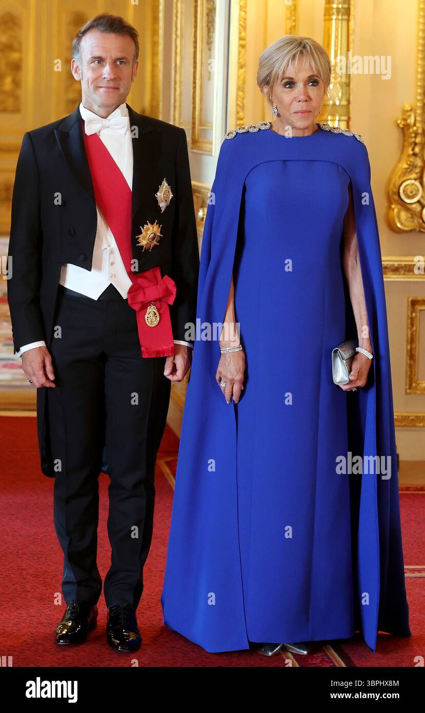 France's President Emmanuel Macron and wife Brigitte Macron attend the