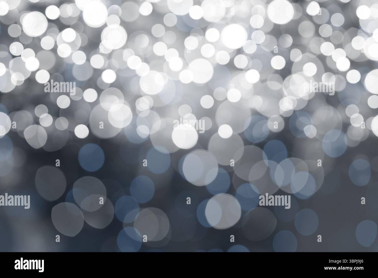 Abstract flat design showing defocused light spots creating bluish white bokeh pattern Stock Photo