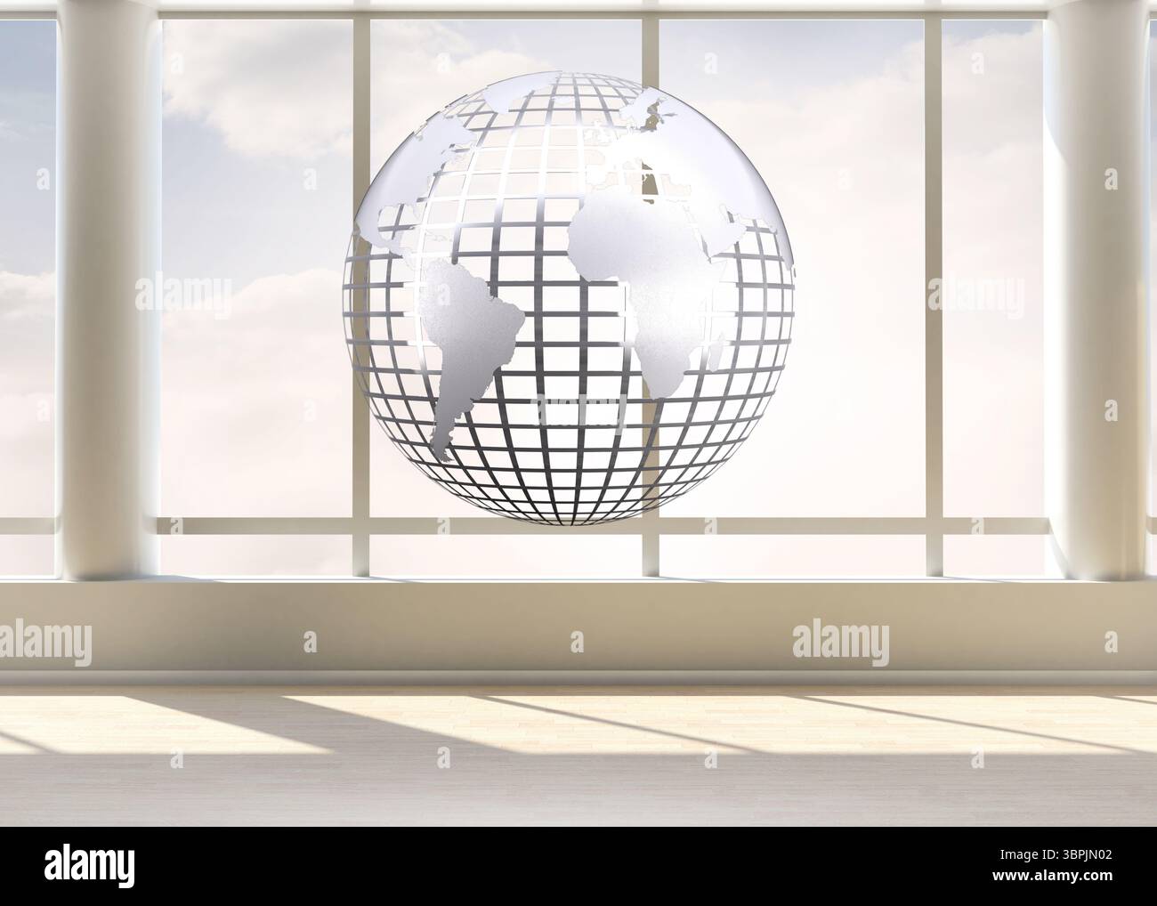 Silver globe floating in room Stock Photo