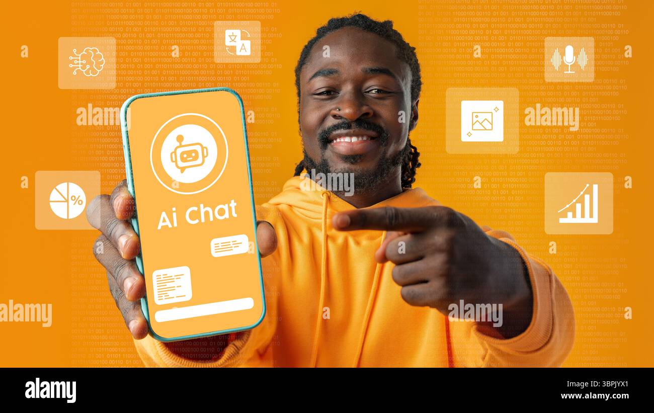 Young man showcasing AI chat application on smartphone with vibrant orange background in a tech-focused environment Stock Photo