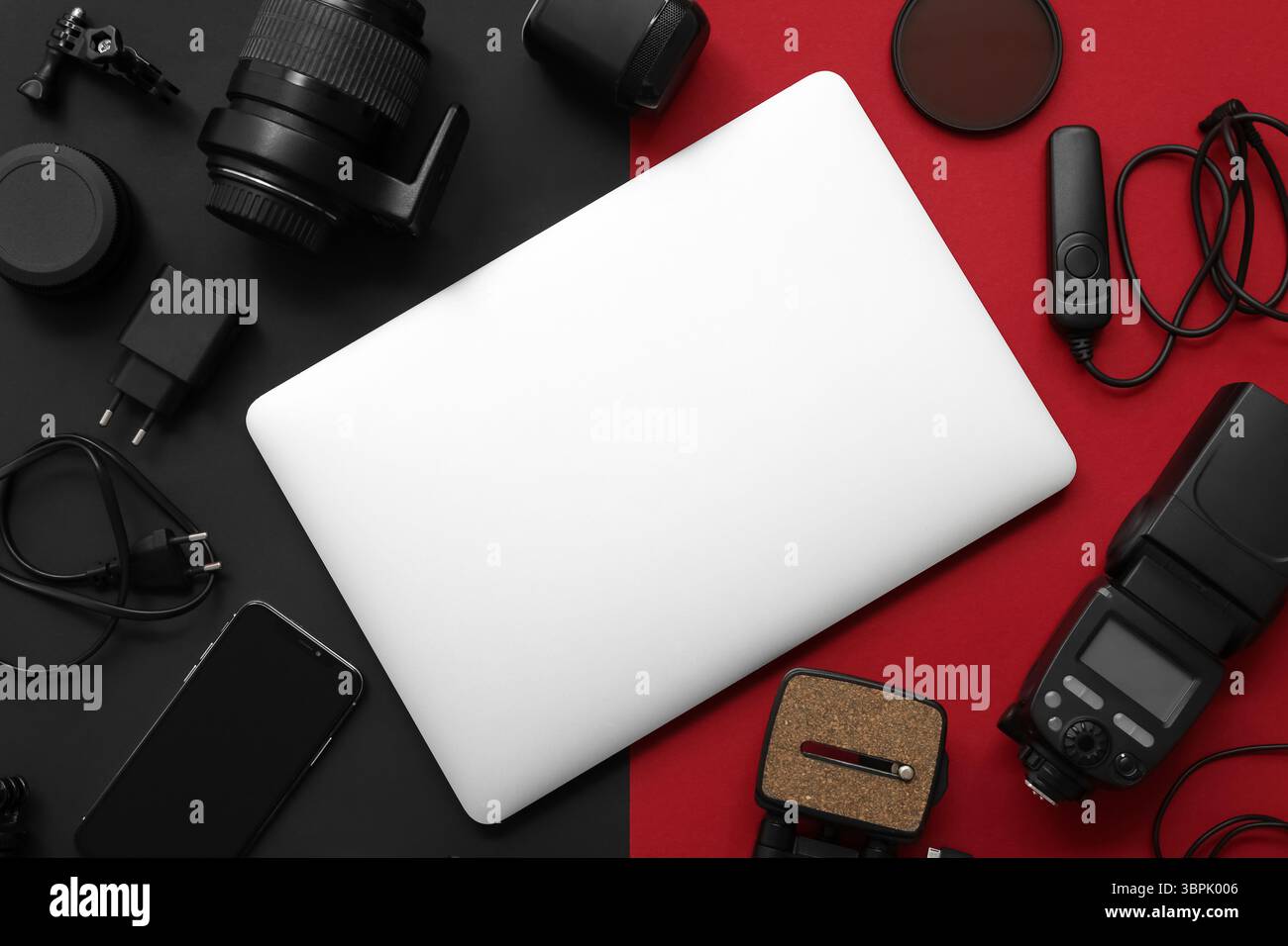 Composition with different gadgets and modern laptop on dark background Stock Photo