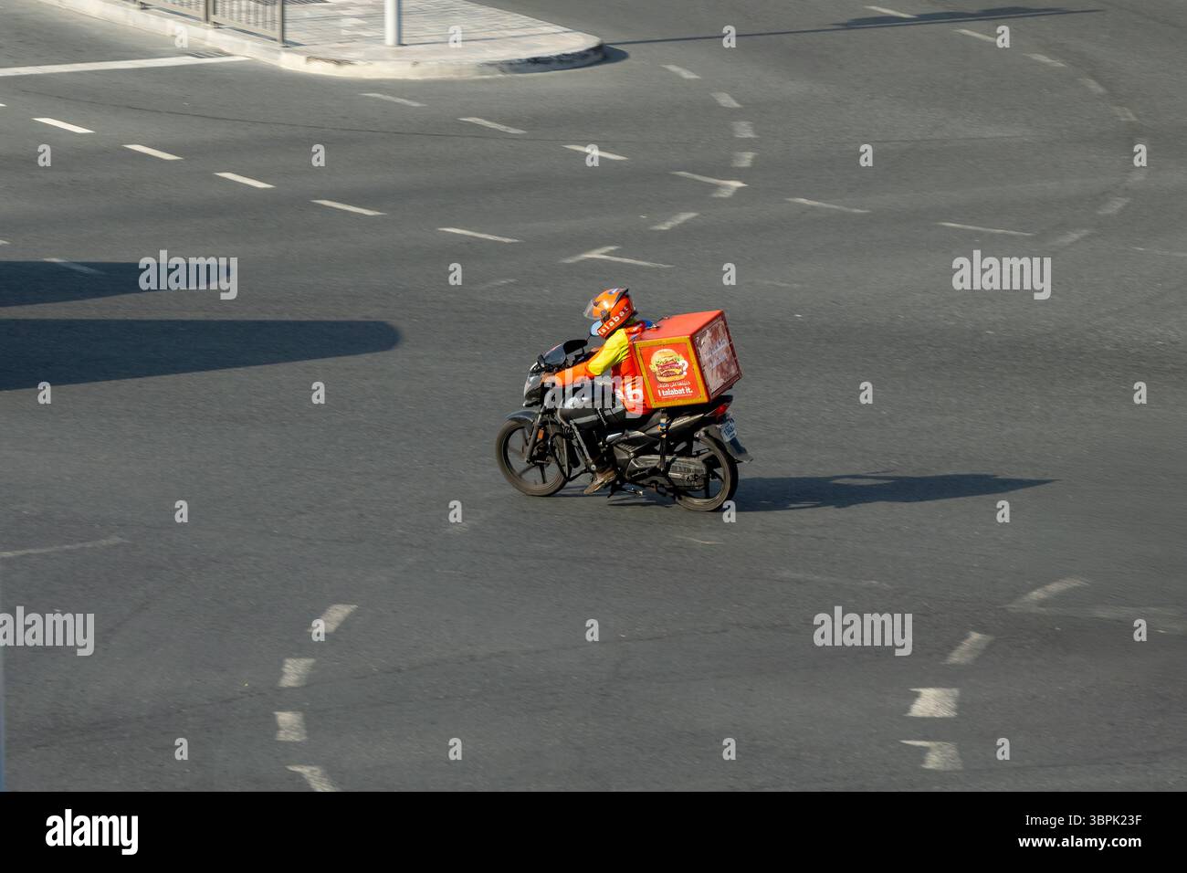 Delivery Rider Talabat Delivery boy Talabat food Delivery rider on road. Online food ordering ...