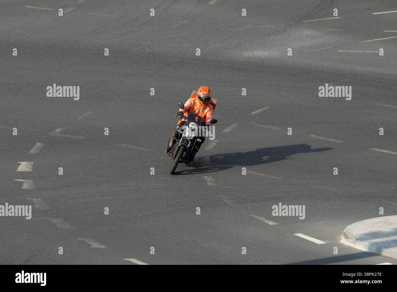Delivery boy Talabat food Delivery rider on road. Online food ordering ...