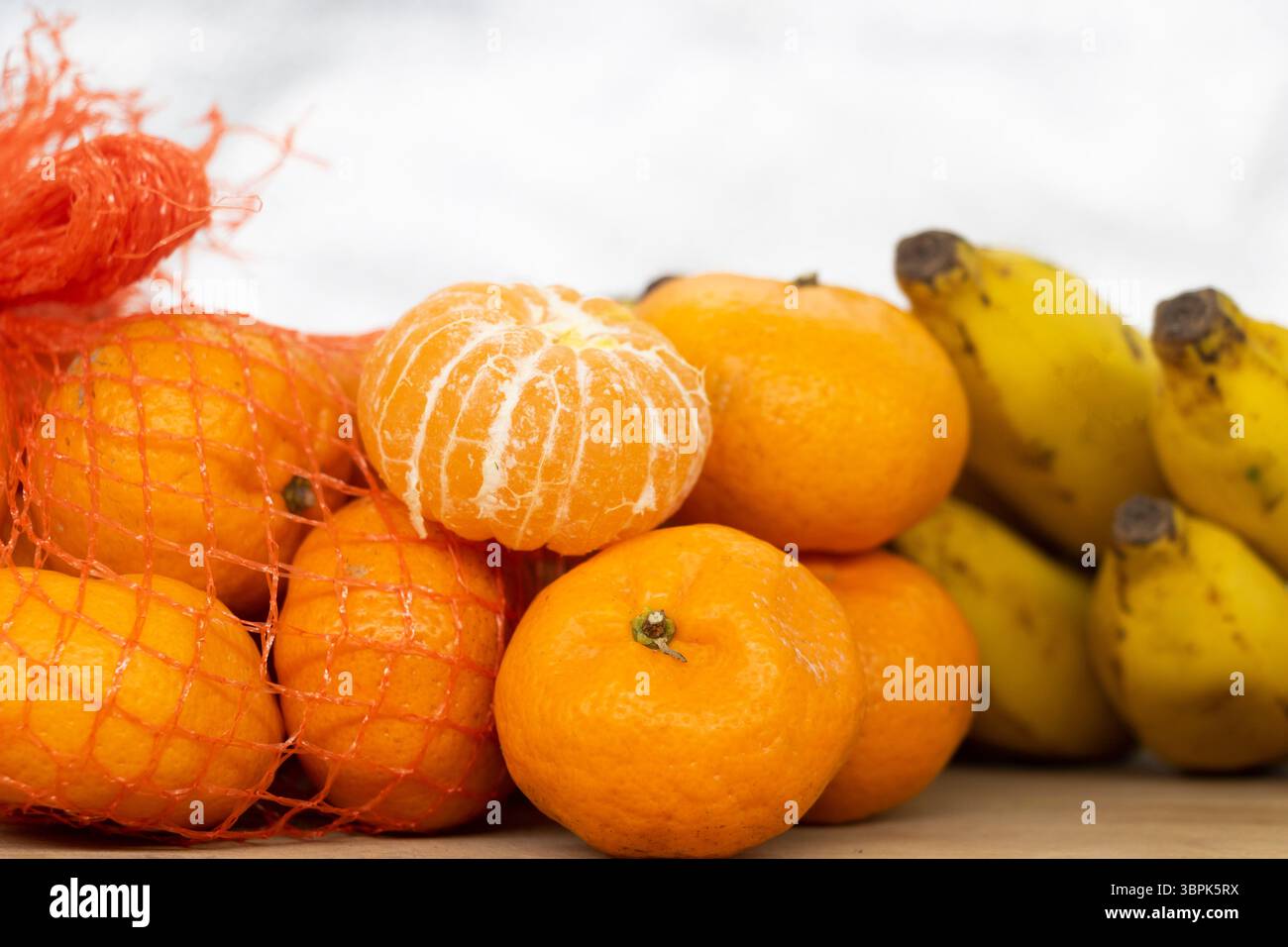Fresh Citrus or tangerina and peeled fruit on white background,.. Stock Photo
