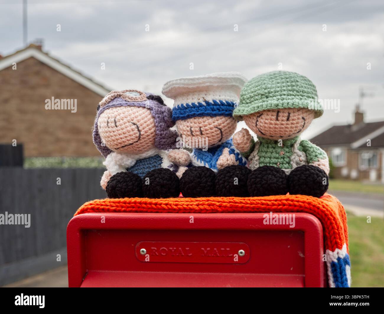 Hackleton Post Box Knitted post box topper featuring an airman, sailor and soldier to ...