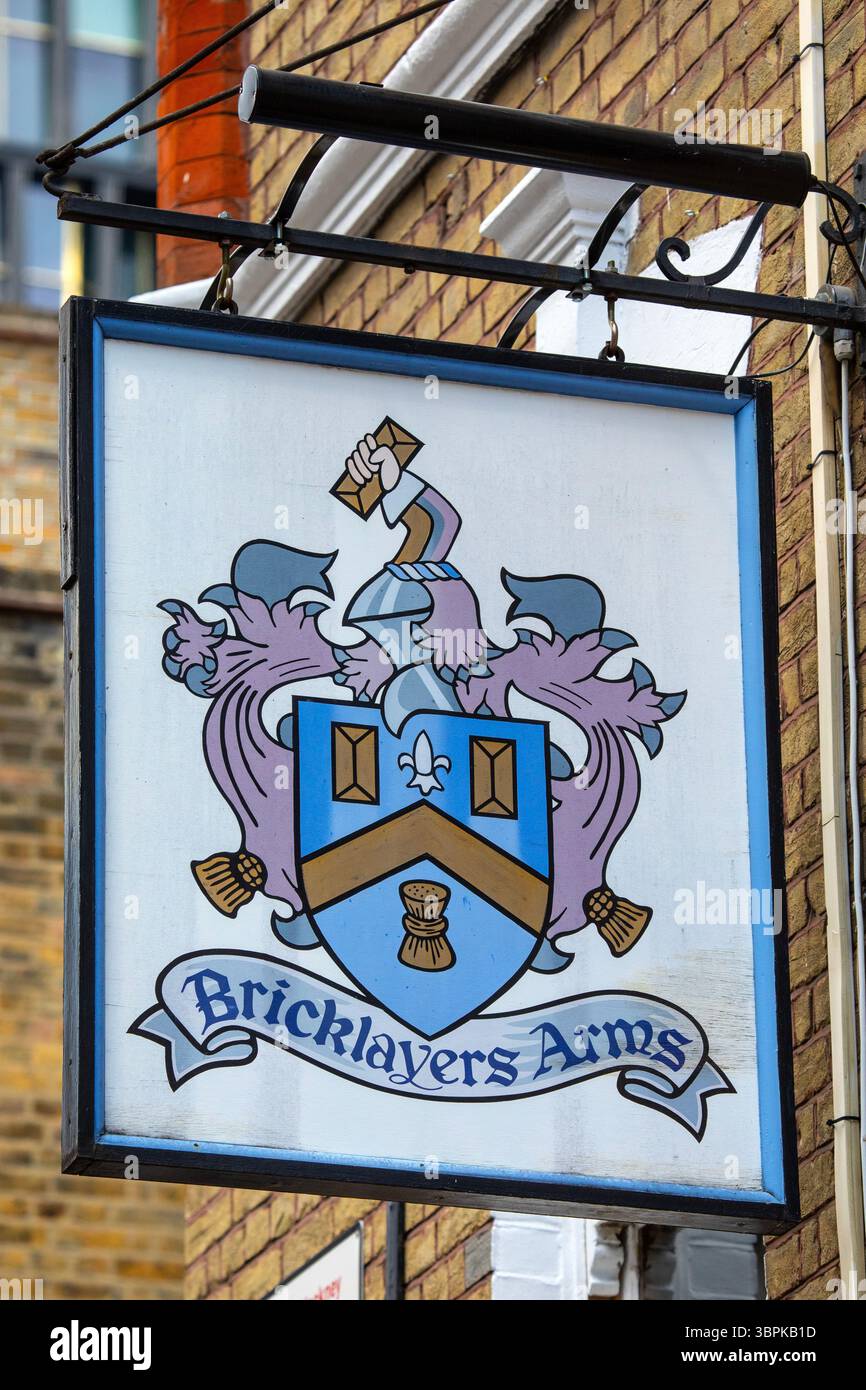 Advertising Bricklayer Sign London, UK - June 2nd 2025: The vintage hanging sign on the exterior of ...