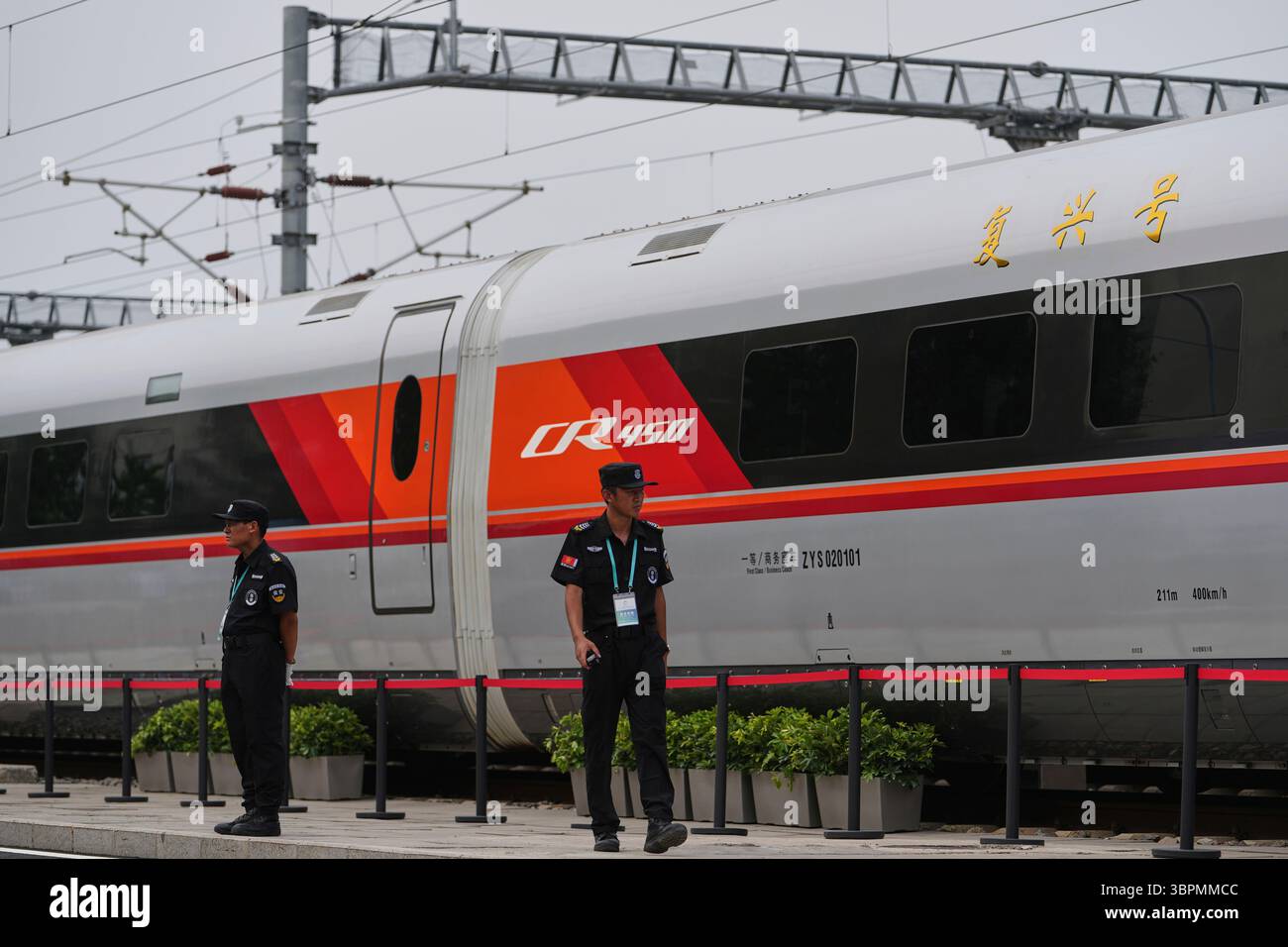 Security guards patrol next to the new generation of Fuxing CR450 high ...