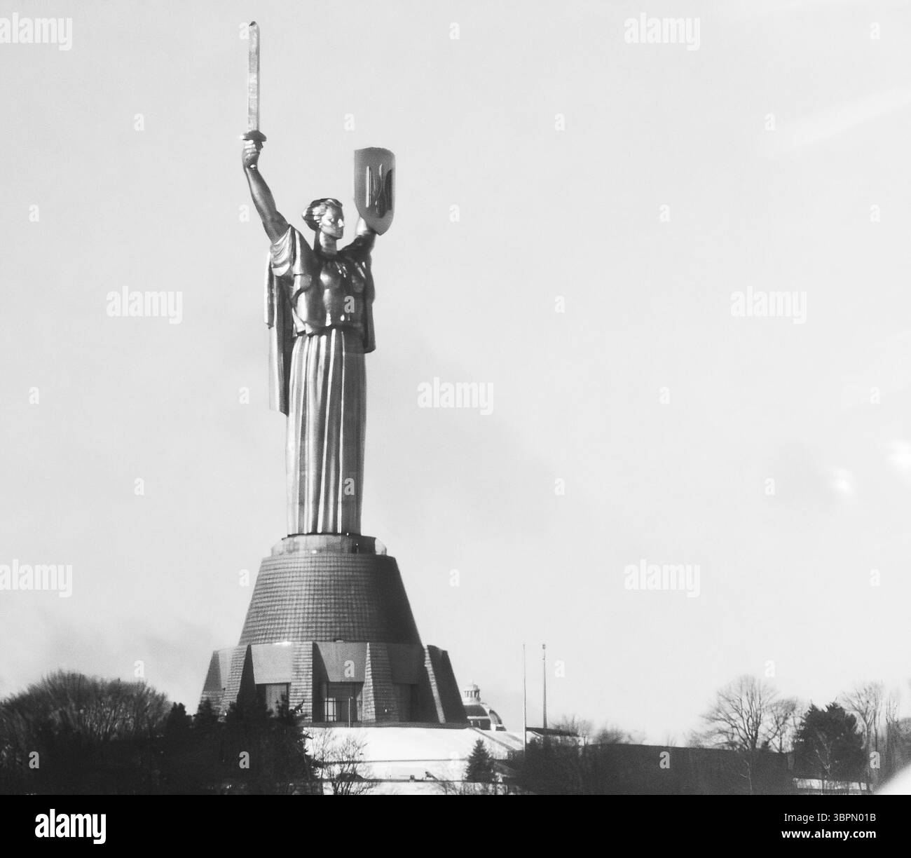 The Monument of the Motherland towers over the skyline of Kyiv, symbolizing strength and unity. This iconic structure captures the spirit of Ukraine a Stock Photo