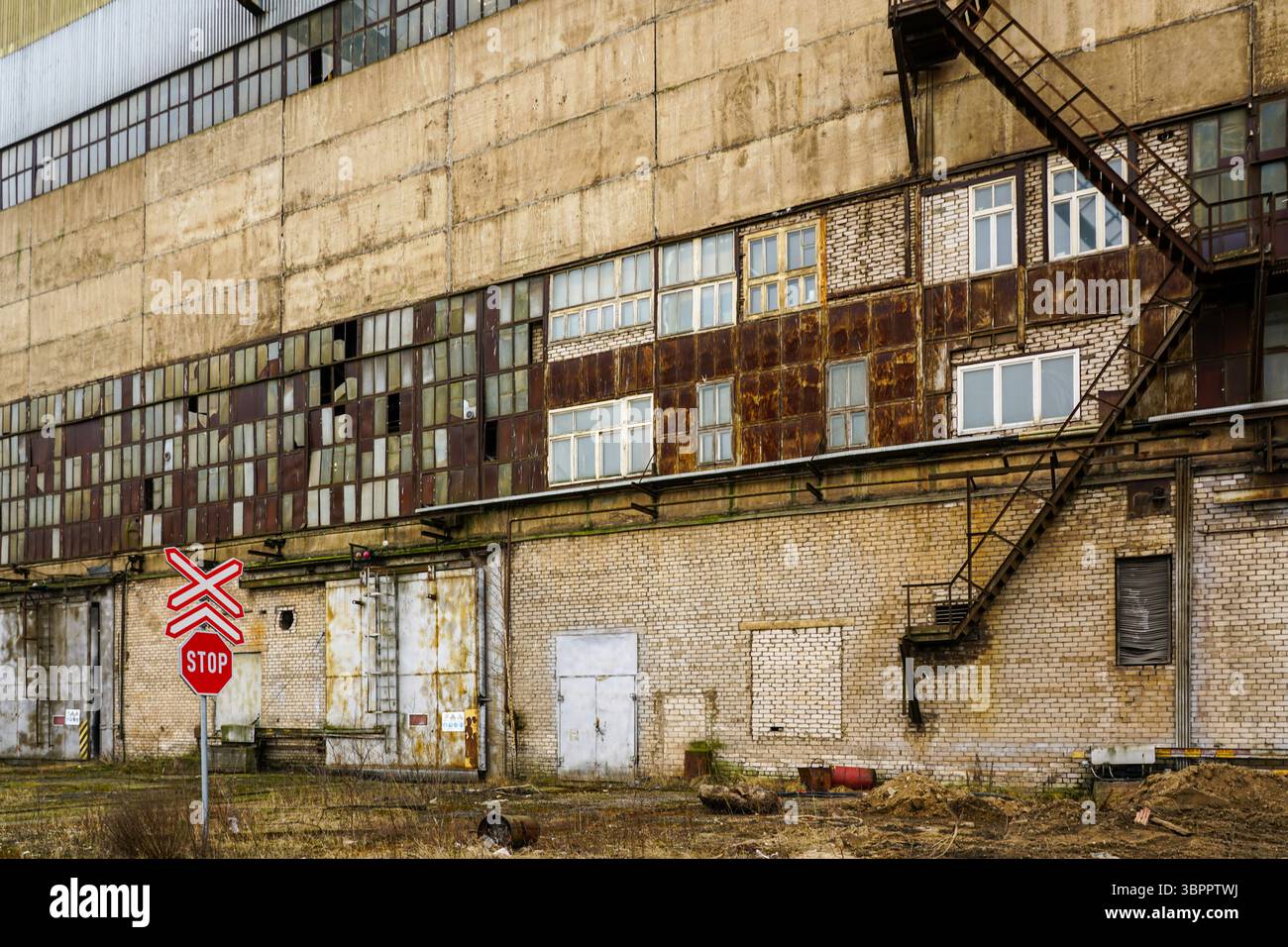Abandoned Industrial Building with Rusty Windows, Brick Walls, and a ...