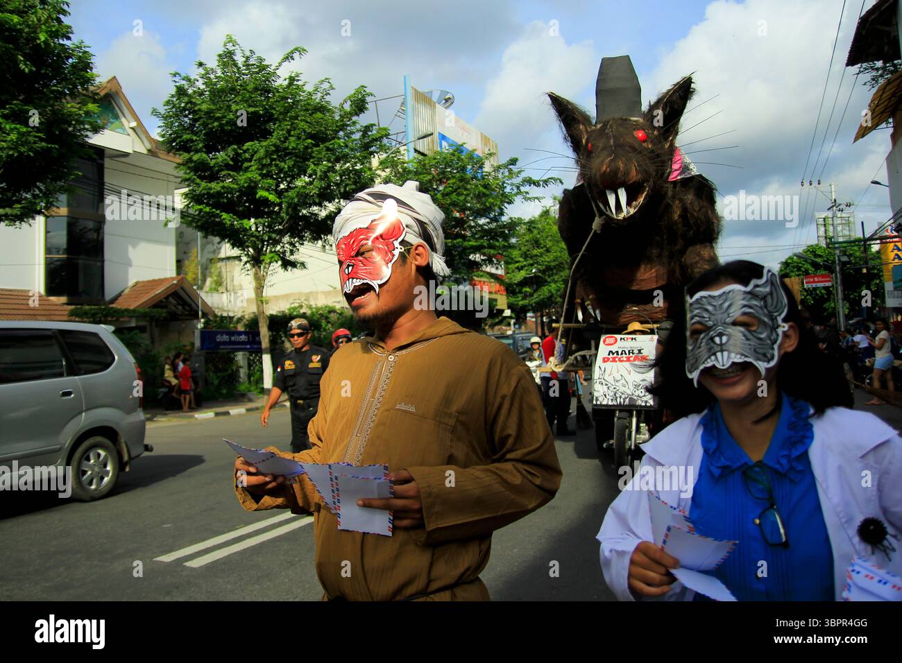 Giant mouse puppets are paraded as a symbol of corruption that must be ...