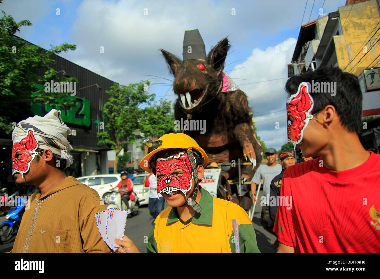 Giant mouse puppets are paraded as a symbol of corruption that must be ...