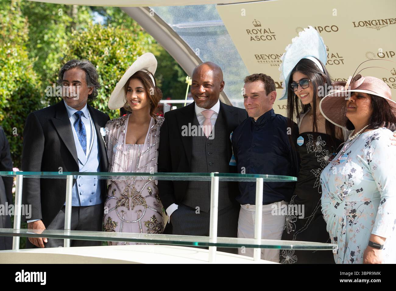 Ascot, UK. 21st June, 2025. Jockey Ryan Moore with cricketer Brian Lara (3rd L) and the Dines family after winning the Wokingham Stakes (Heritage Handicap) Stakes on Day Five of Royal Ascot 2025 at Ascot Racecourse in Berkshire. Credit: Maureen McLean/Alamy Stock Photo