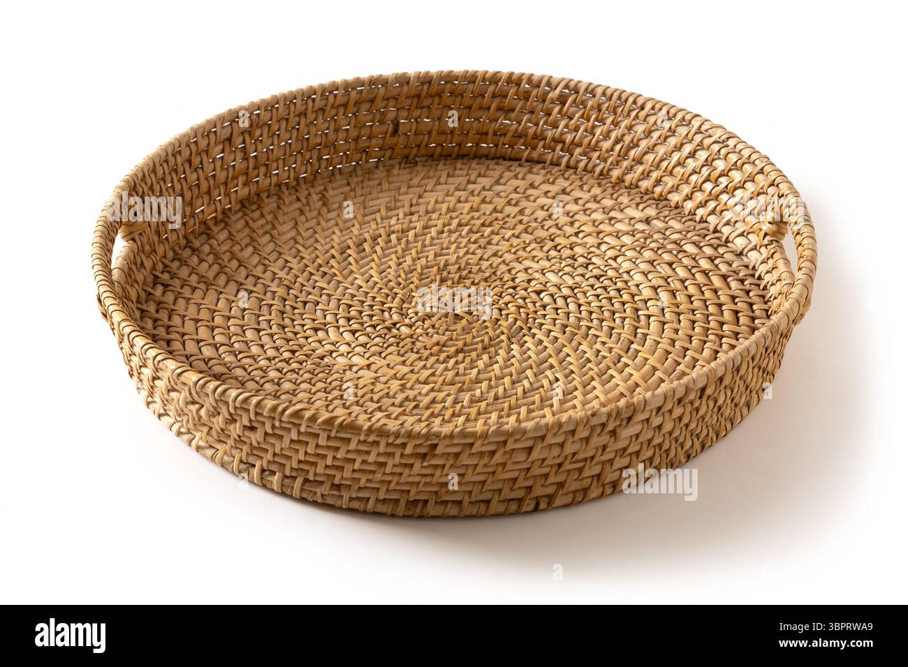 Wicker woven bamboo tray isolated on white background. Handmade by local craftsmen in sri lanka traditional tableware. Close up. Stock Photo