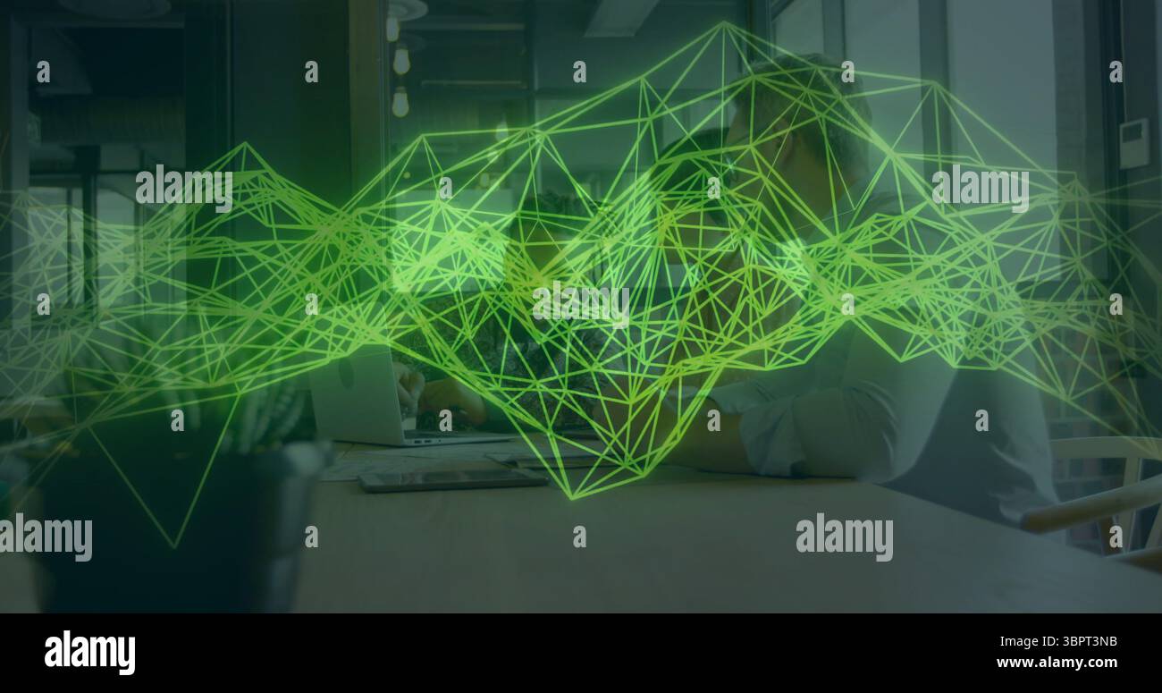 Green geometric network image over people working at office table Stock Photo
