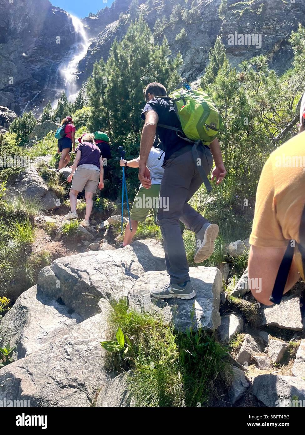 Hiking in Bulgaria Hikers at the Skakavitsa waterfall in Skakavitsa Nature Reserve in Rila National Park, Bulgaria, Balkans, Southeastern Europe - Smartphone Captured Stock Image