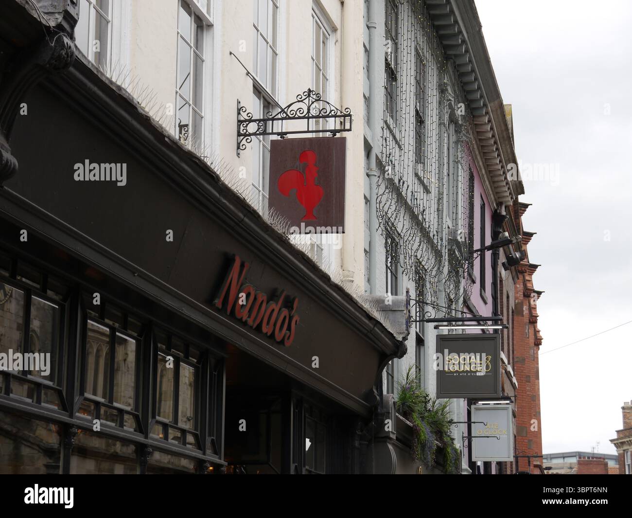 Nando’s, chicken Corporate logo signs in York City centre in June 2025 ...